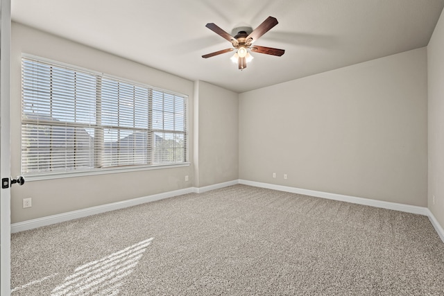 empty room featuring ceiling fan and carpet floors