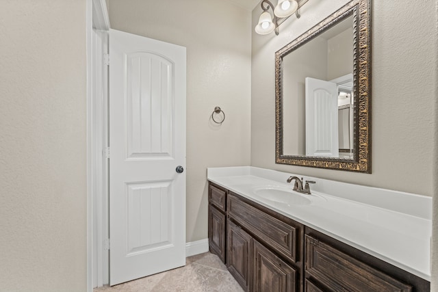 bathroom with tile patterned floors and vanity