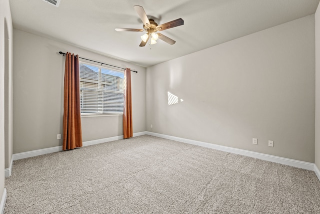 empty room with carpet and ceiling fan