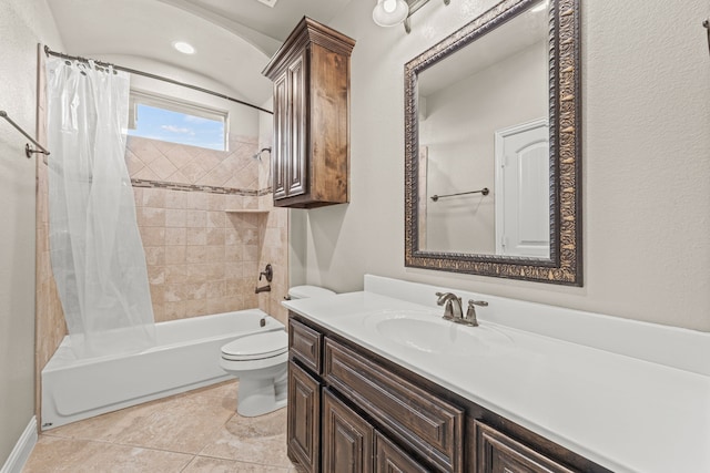 full bathroom featuring tile patterned flooring, shower / tub combo with curtain, vanity, and toilet