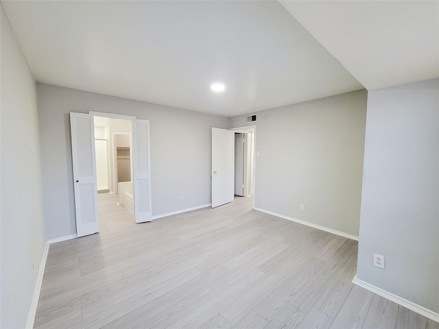 unfurnished room featuring light wood-type flooring