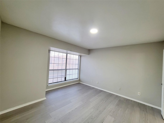 unfurnished room featuring light hardwood / wood-style floors