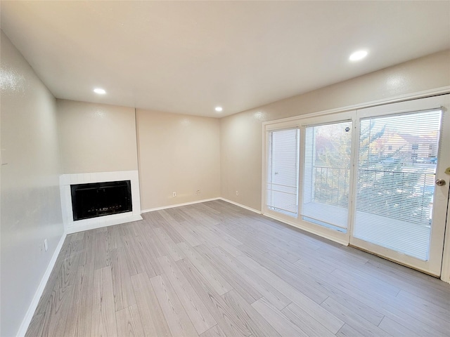 unfurnished living room featuring light wood-type flooring