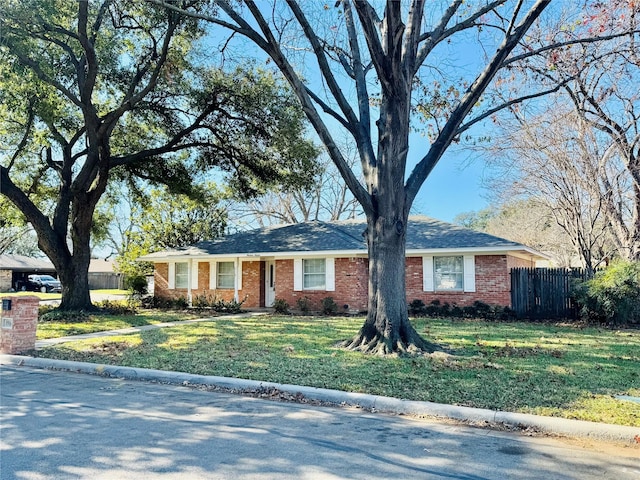 single story home with a front yard