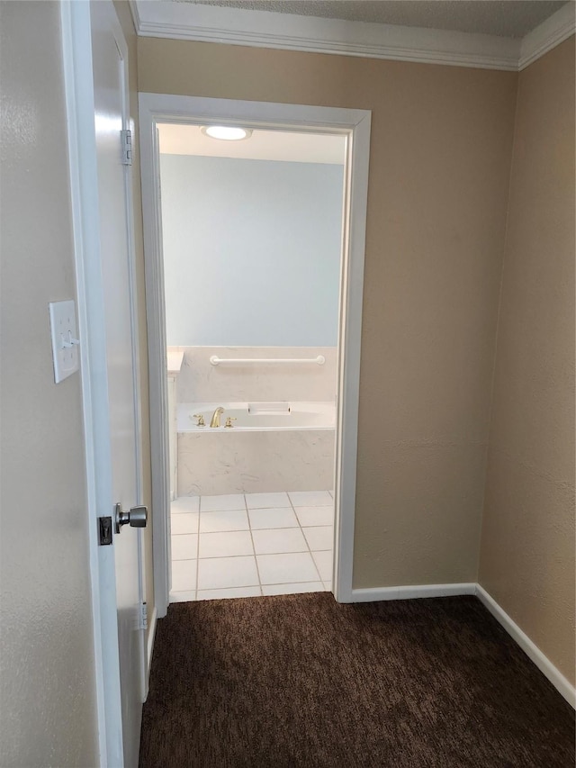 hall with light carpet and ornamental molding