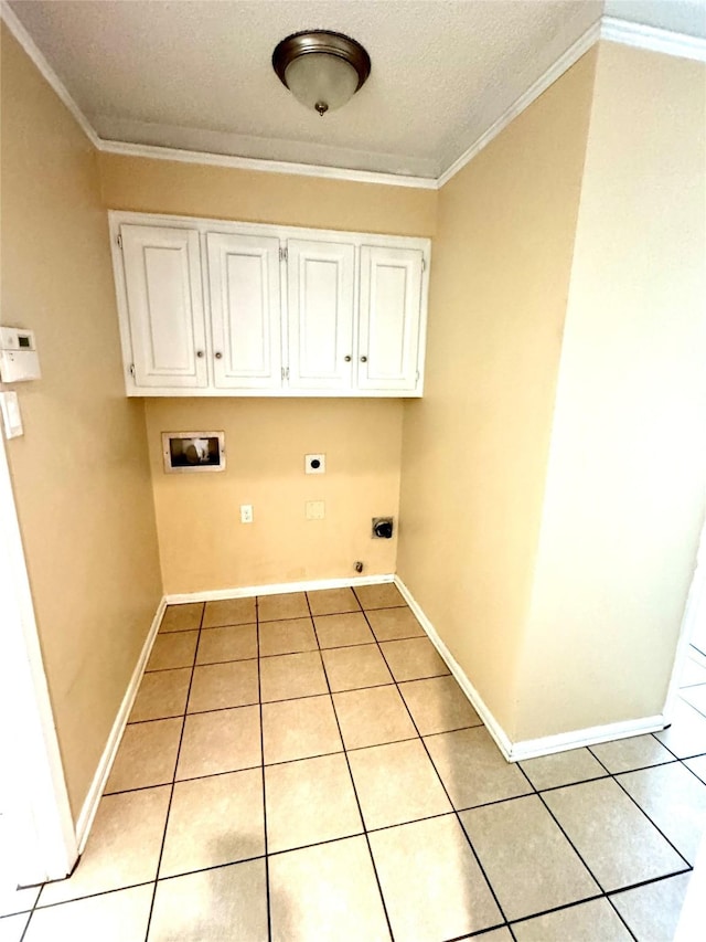 laundry room featuring crown molding, washer hookup, hookup for an electric dryer, and light tile patterned floors