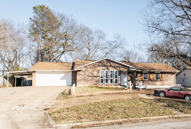 ranch-style house featuring a carport and a garage