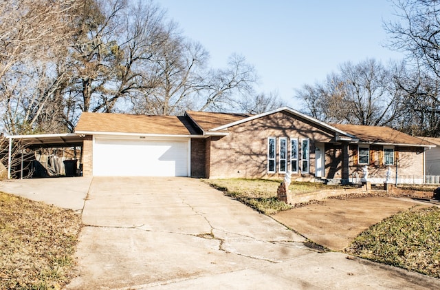 ranch-style home with a garage and a carport