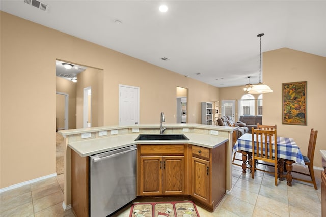 kitchen with a kitchen island with sink, sink, light tile patterned floors, decorative light fixtures, and dishwasher