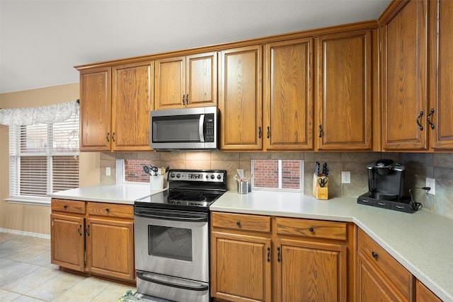 kitchen featuring decorative backsplash and stainless steel appliances