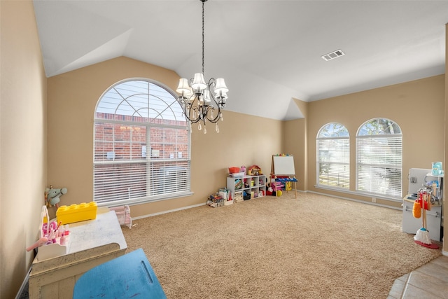 rec room featuring a chandelier, carpet, and lofted ceiling