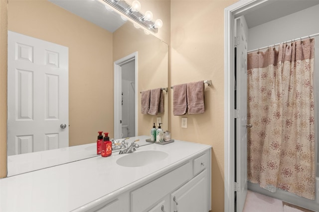 bathroom with tile patterned floors, vanity, and shower / bathtub combination with curtain