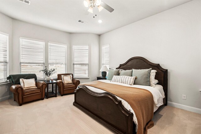 bedroom with ceiling fan and light colored carpet