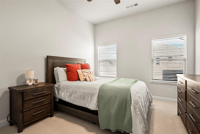 bedroom with light colored carpet and ceiling fan