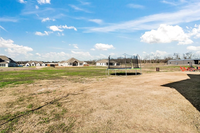 view of yard with a trampoline