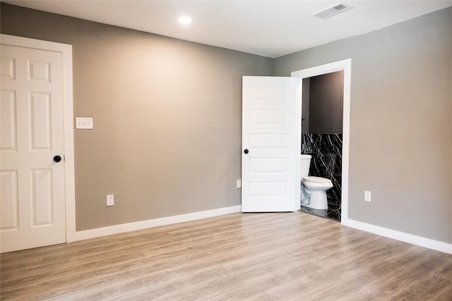 unfurnished bedroom with light hardwood / wood-style flooring