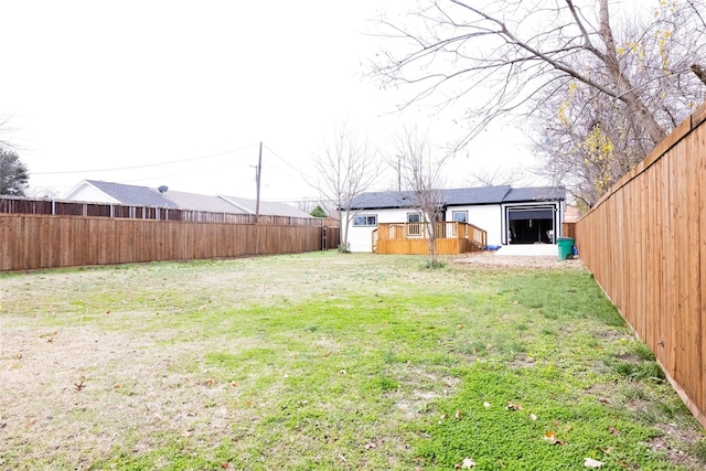 view of yard featuring a wooden deck