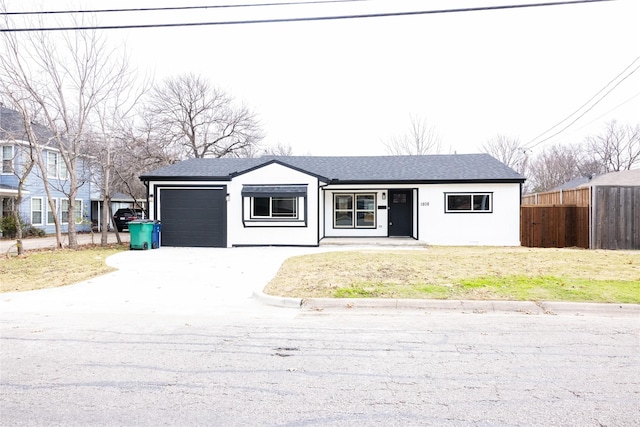 view of front facade with a garage and a front yard