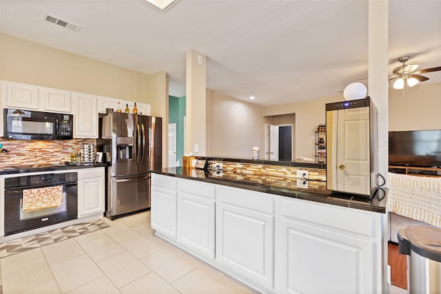 kitchen with tasteful backsplash, ceiling fan, black appliances, light tile patterned floors, and white cabinets