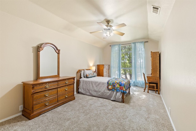 carpeted bedroom featuring vaulted ceiling and ceiling fan