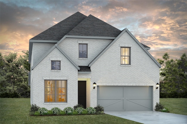 view of front facade featuring a yard and a garage