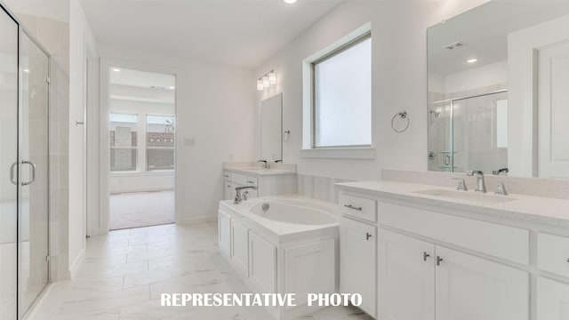 bathroom with vanity and an enclosed shower