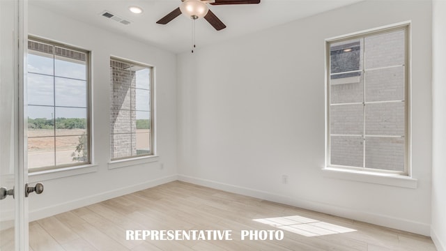 unfurnished room featuring light hardwood / wood-style flooring and ceiling fan