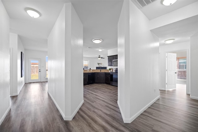 corridor featuring hardwood / wood-style floors