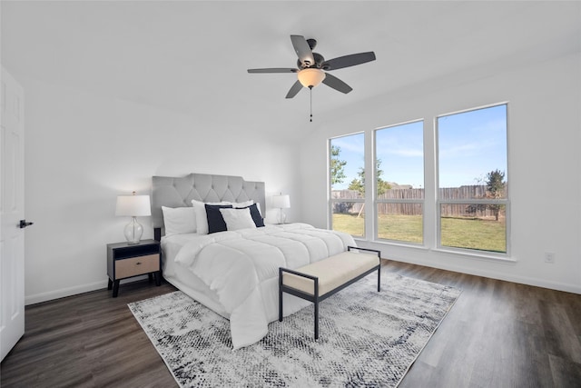 bedroom with ceiling fan and dark hardwood / wood-style floors