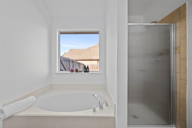 bathroom with shower with separate bathtub