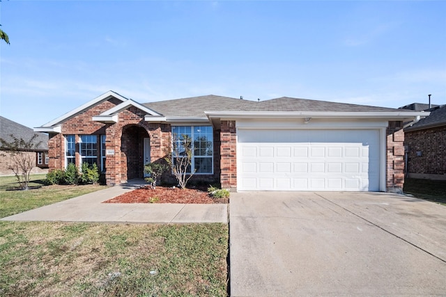 single story home with a front yard and a garage