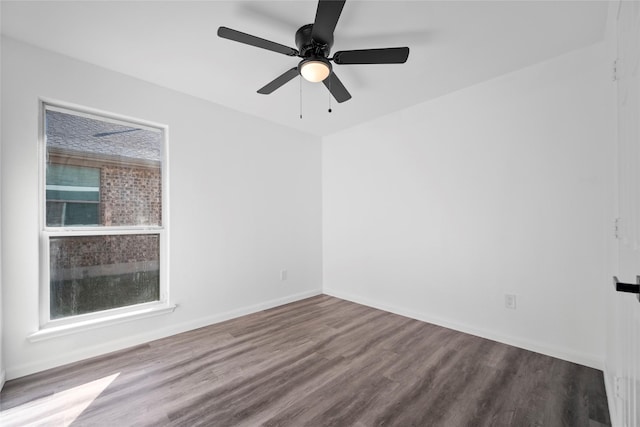 empty room with hardwood / wood-style flooring and ceiling fan