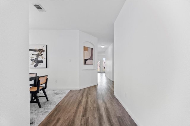 hallway with wood-type flooring