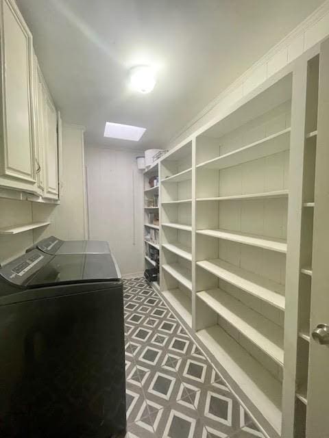 pantry featuring washing machine and clothes dryer