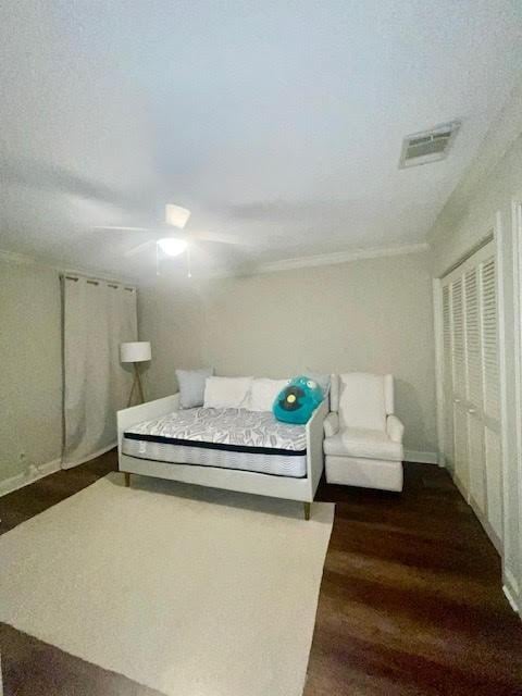 bedroom featuring dark hardwood / wood-style floors and ceiling fan