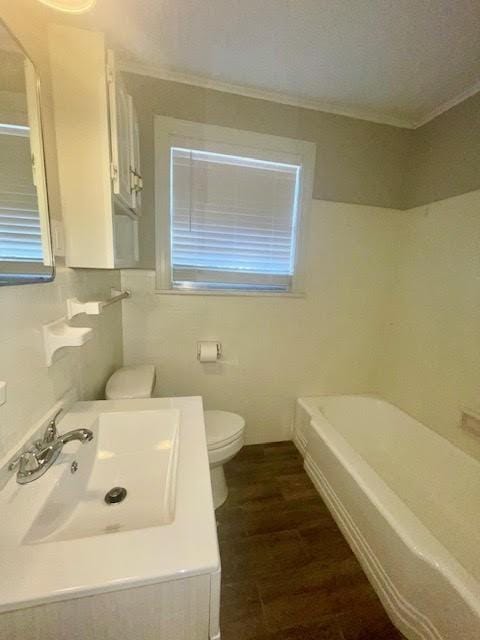 full bathroom with toilet, wood-type flooring, sink, and plus walk in shower