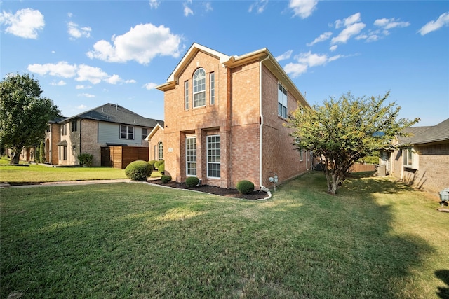 view of side of property featuring a yard