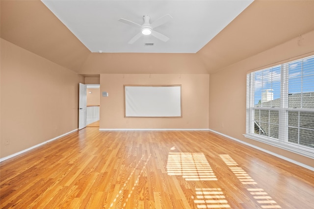 spare room featuring ceiling fan, light hardwood / wood-style flooring, and lofted ceiling