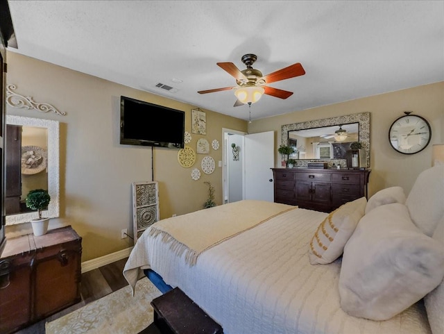 bedroom with hardwood / wood-style floors and ceiling fan