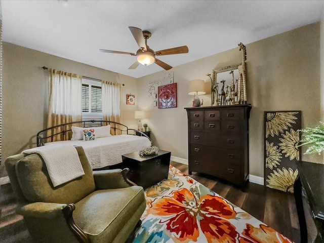 bedroom with ceiling fan and dark wood-type flooring