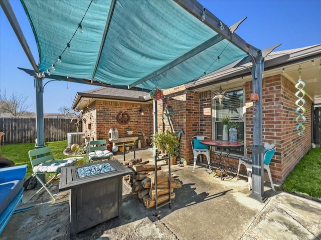 view of patio / terrace with an outdoor fire pit