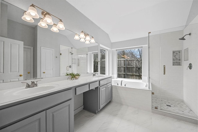 bathroom with vanity, lofted ceiling, and shower with separate bathtub