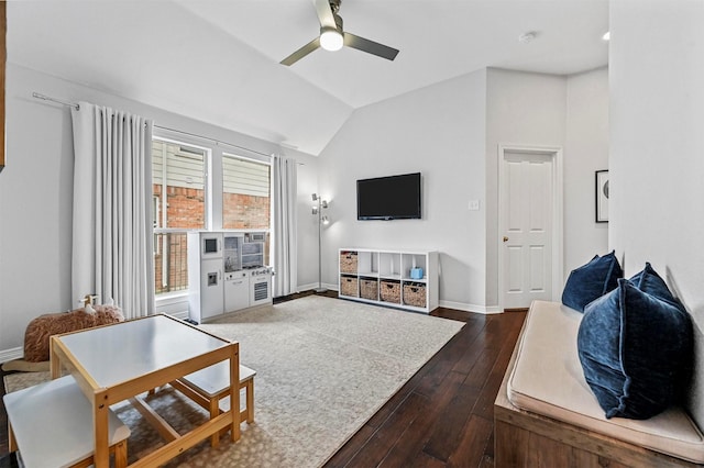 living room with ceiling fan, dark wood-type flooring, and vaulted ceiling