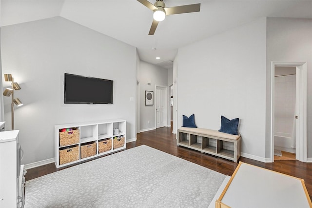 sitting room featuring ceiling fan, dark wood-type flooring, and vaulted ceiling