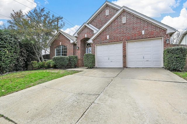 view of front property featuring a front yard and a garage