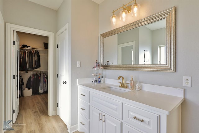 bathroom featuring hardwood / wood-style flooring and vanity