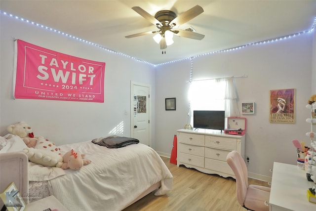 bedroom featuring ceiling fan and light wood-type flooring