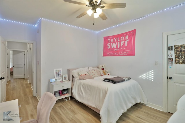 bedroom with wood-type flooring and ceiling fan