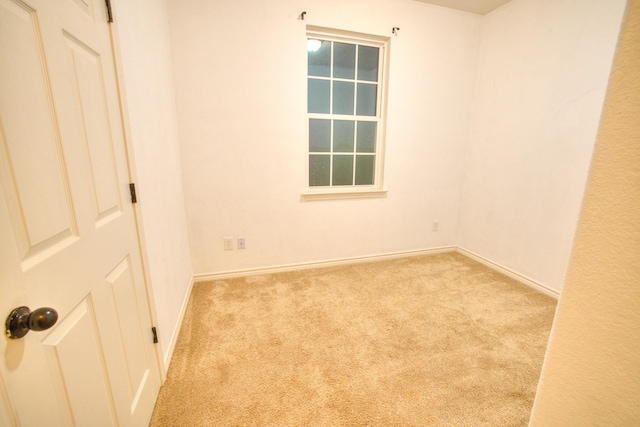 empty room with light colored carpet