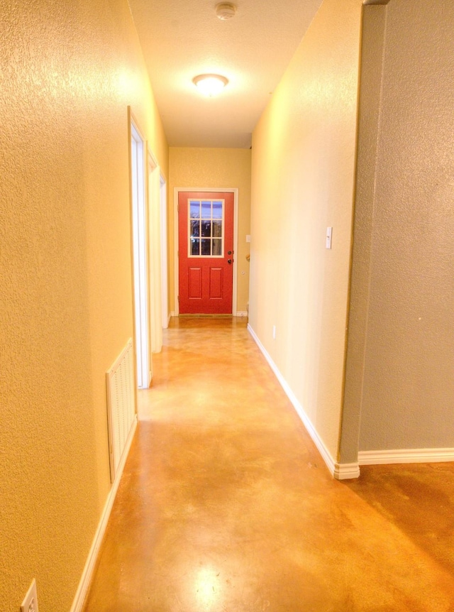 hallway featuring concrete floors